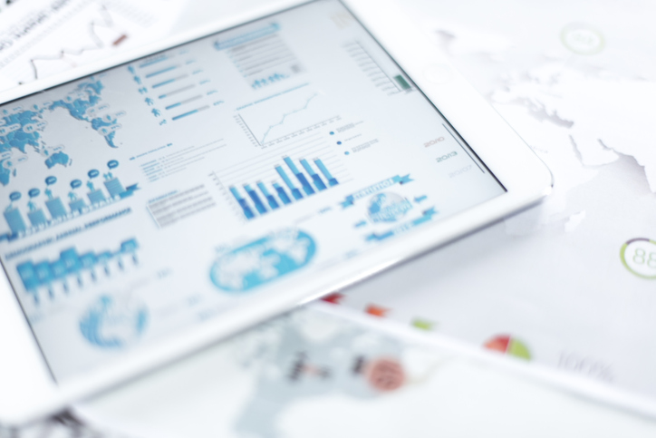 close up on tablet with charts and graphs for wealth management