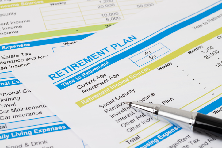 Retirement planning documents with pen