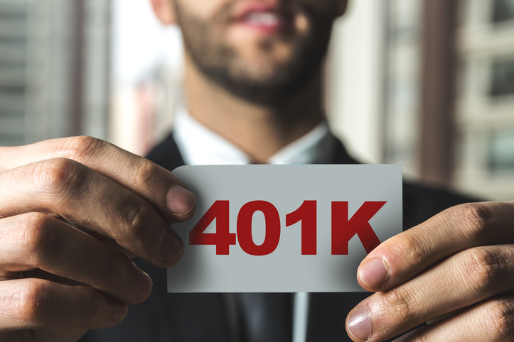 businessman holding a 401k sign