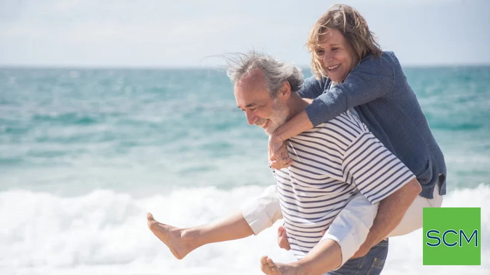 Retired couple on beach