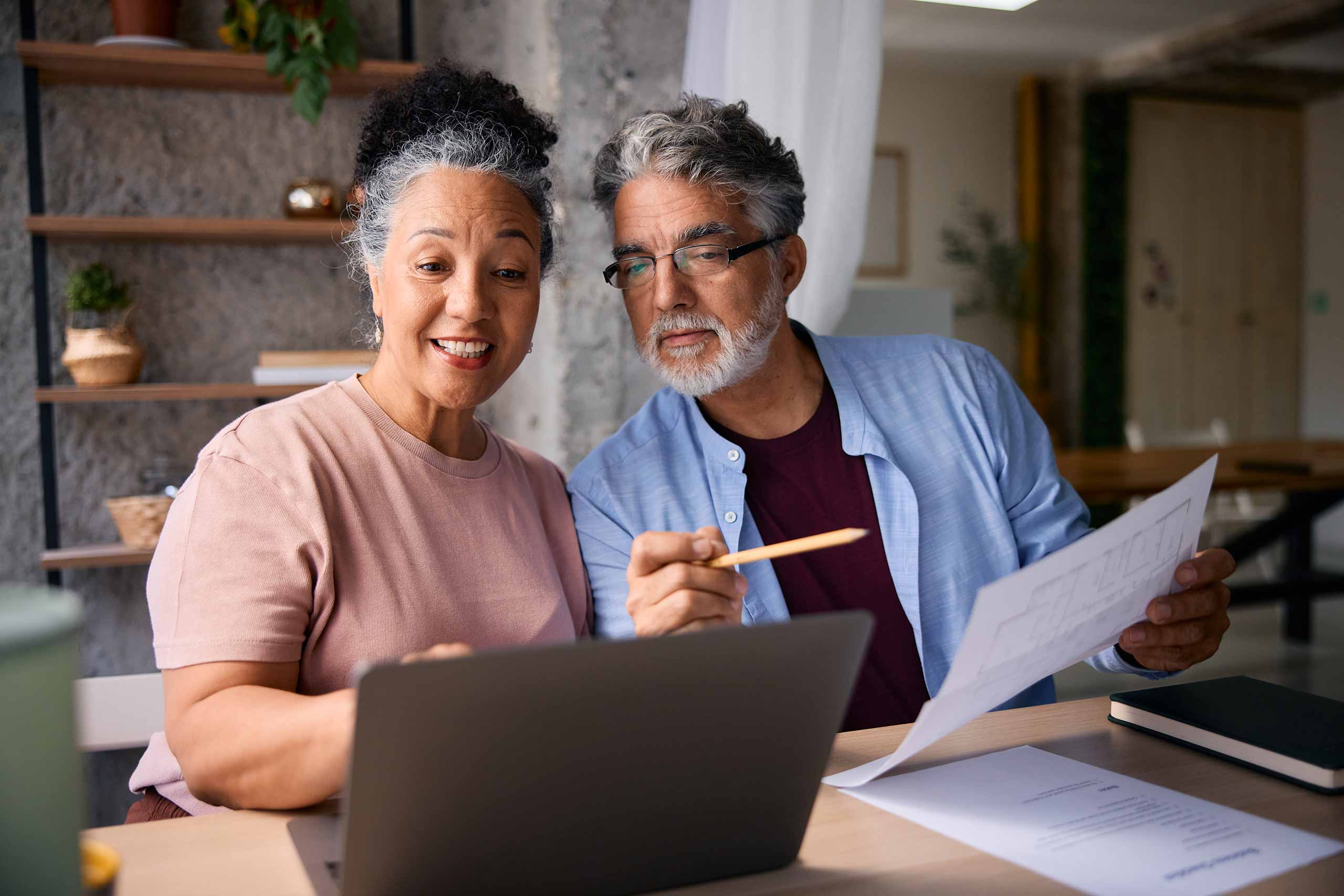 Couple working on their finances on laptop